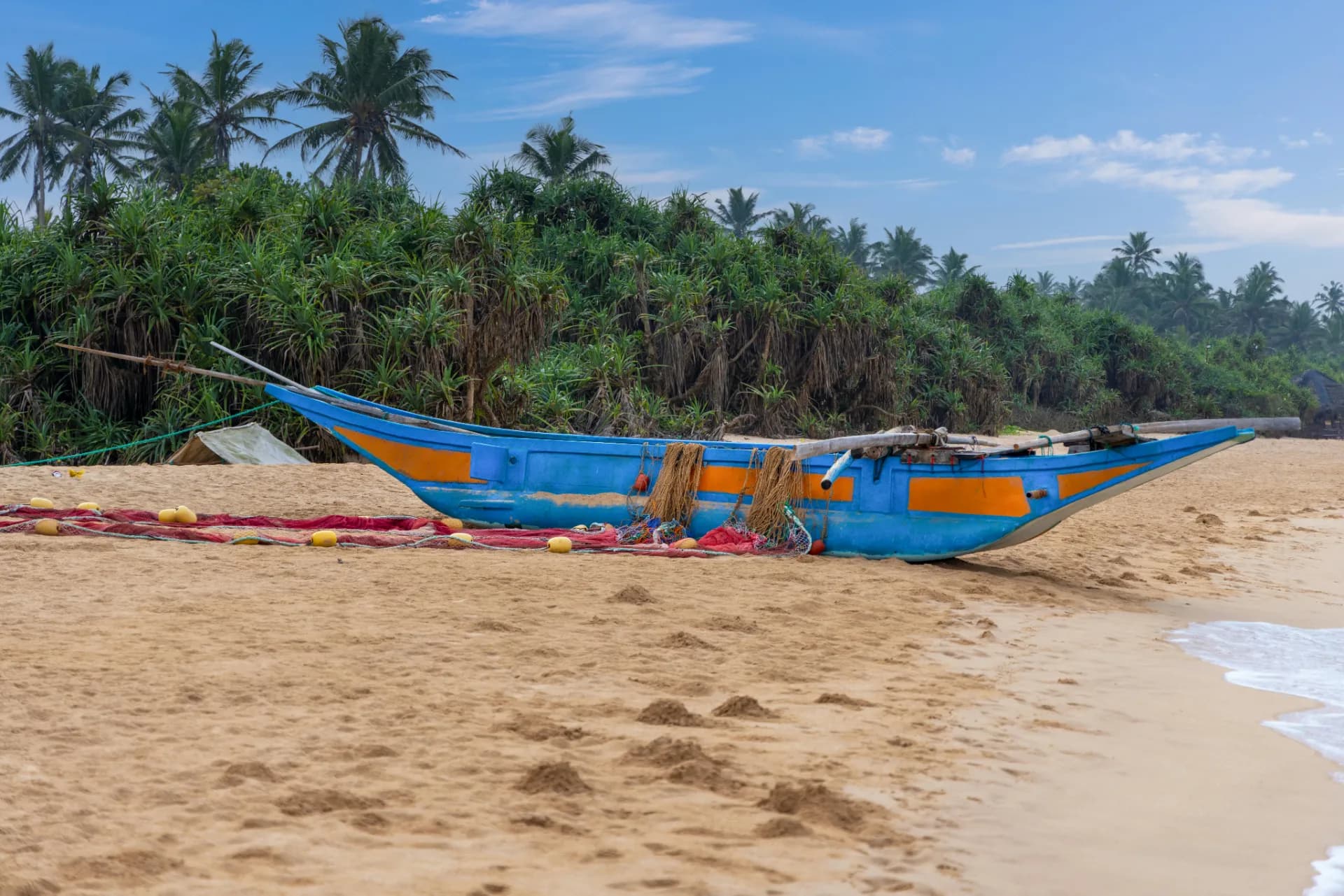 Golden sandy beach at Bentota with calm turquoise waters