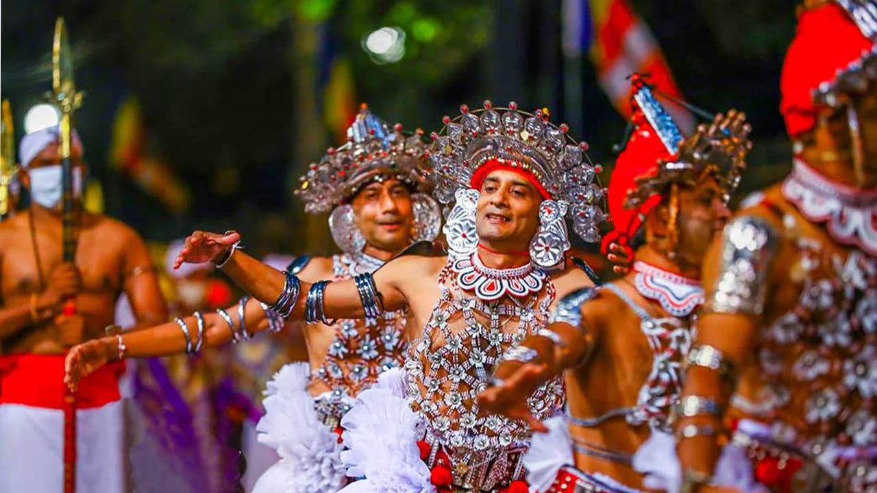 Kandy dancer in full ceremonial costume — one of the most photographed subjects at the Perahera