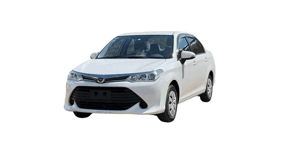 Silver Toyota sedan in a lush green tea estate